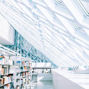 Books in a white futuristic setting for speculative fiction beta reading