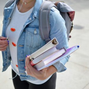 High school student carrying YA novels